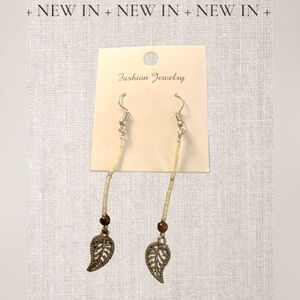 Handmade from Venice Italy boho silver tone metal Leaf and tan beaded earrings!